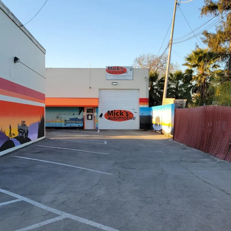 Driveway to Mick’s Automotive past the forest mural